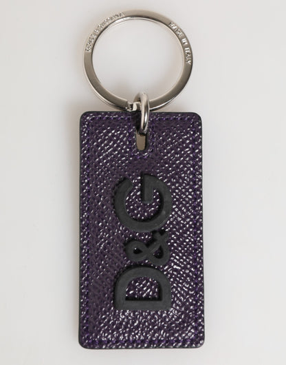 Porte-clés homme Dolce &amp; Gabbana en cuir violet avec logo métallique et anneau.