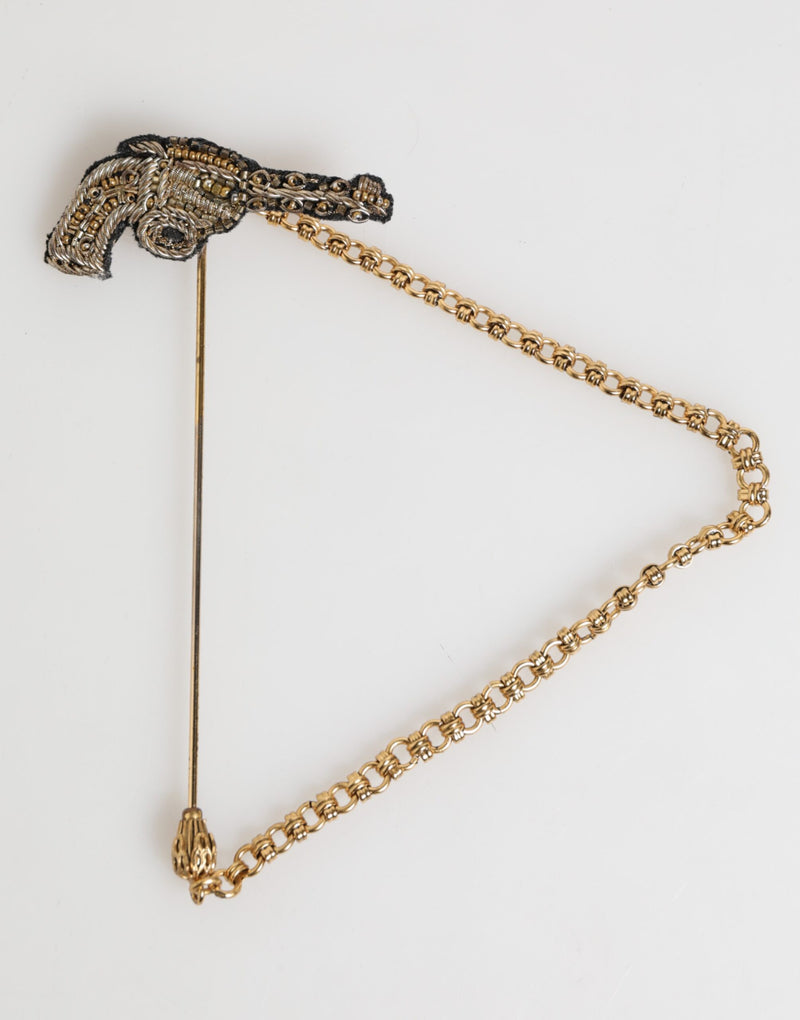 Broche accessoire homme Dolce & Gabbana, épingle de revers en laiton et cuivre, revolver.