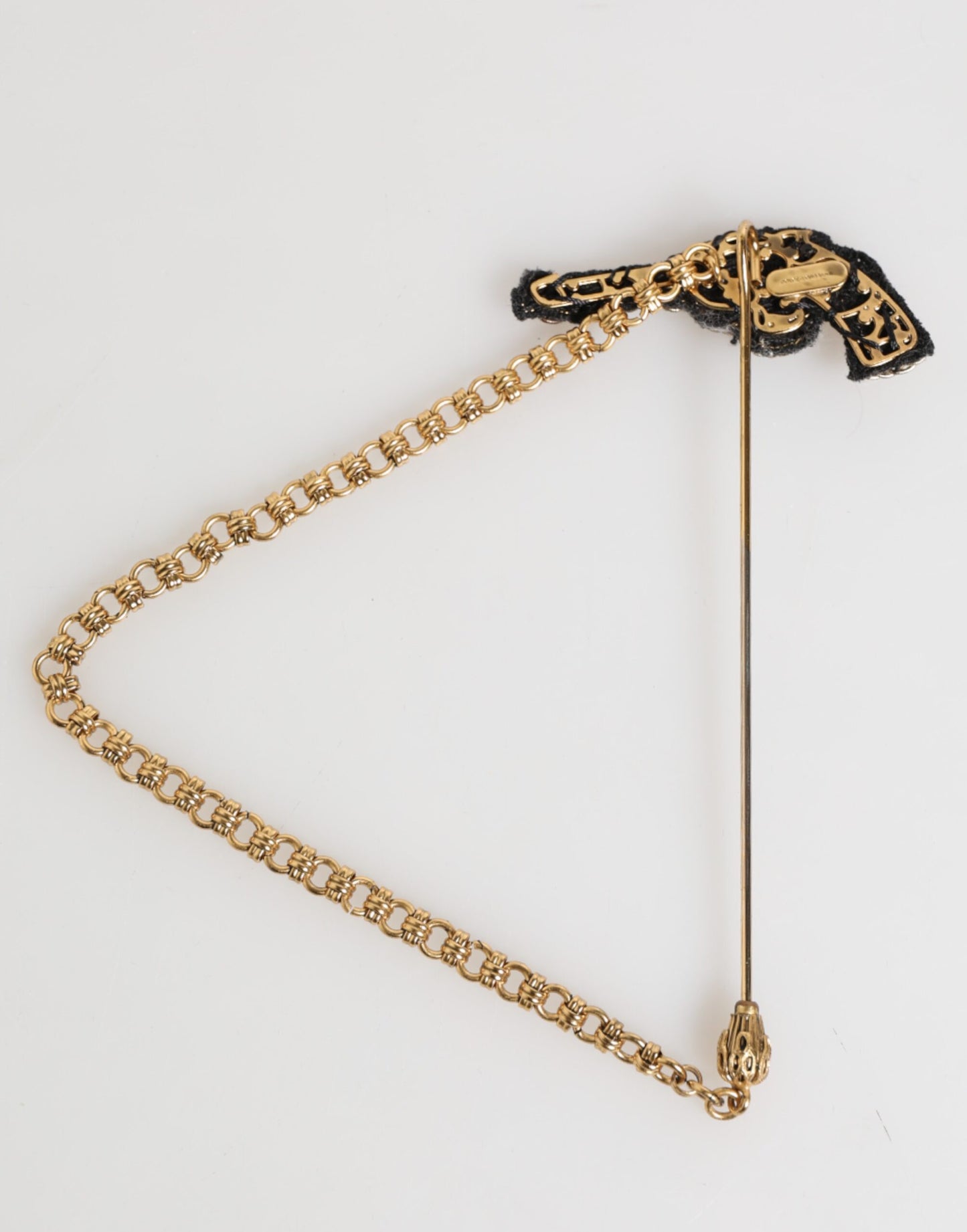 Broche accessoire homme Dolce &amp; Gabbana, épingle de revers en laiton et cuivre, revolver.
