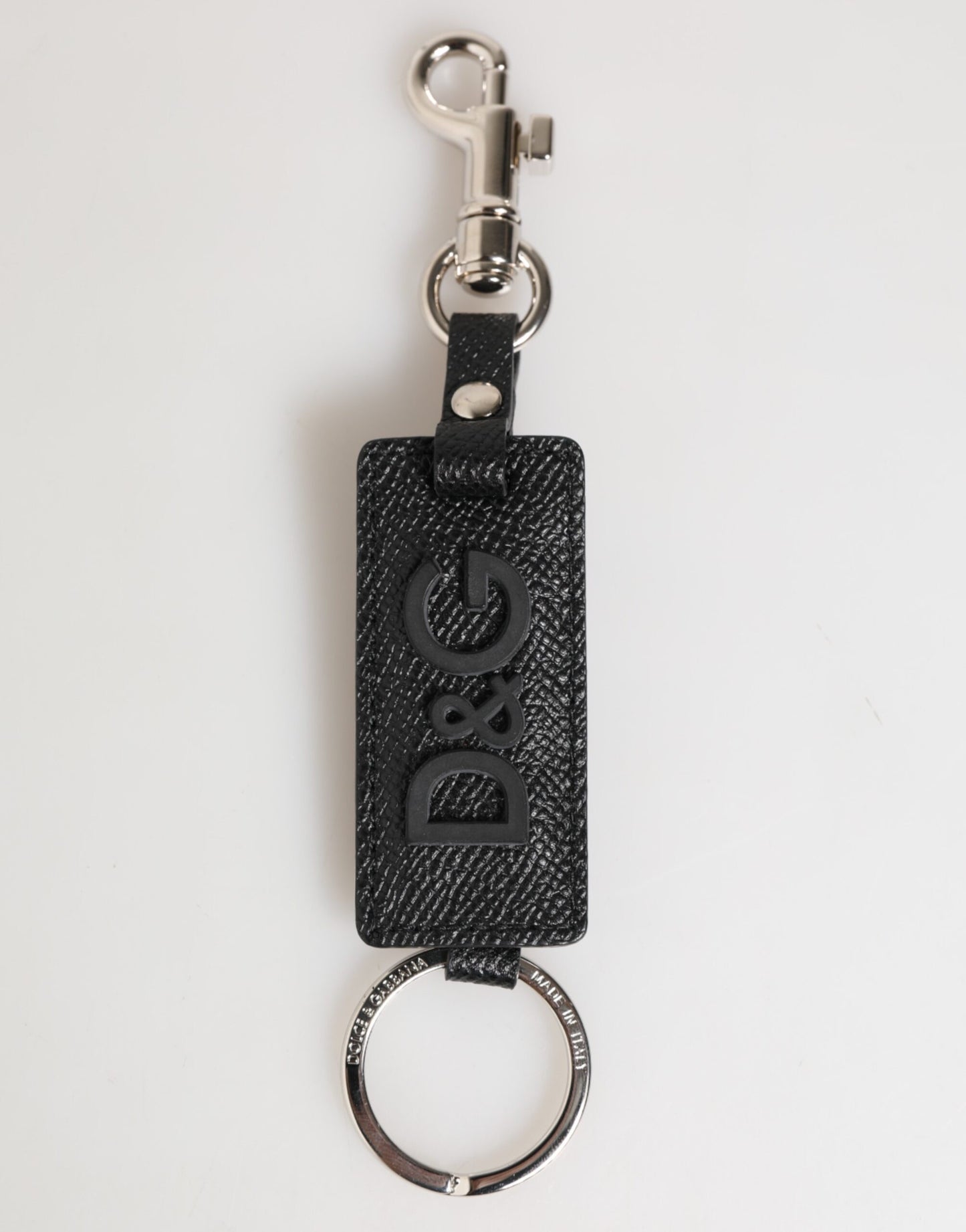 Porte-clés en cuir noir Dolce &amp; Gabbana avec logo métallique et anneau.