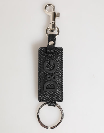 Porte-clés en cuir noir Dolce &amp; Gabbana avec logo métallique et anneau.