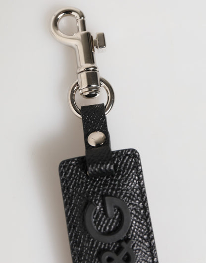 Porte-clés en cuir noir Dolce &amp; Gabbana avec logo métallique et anneau.