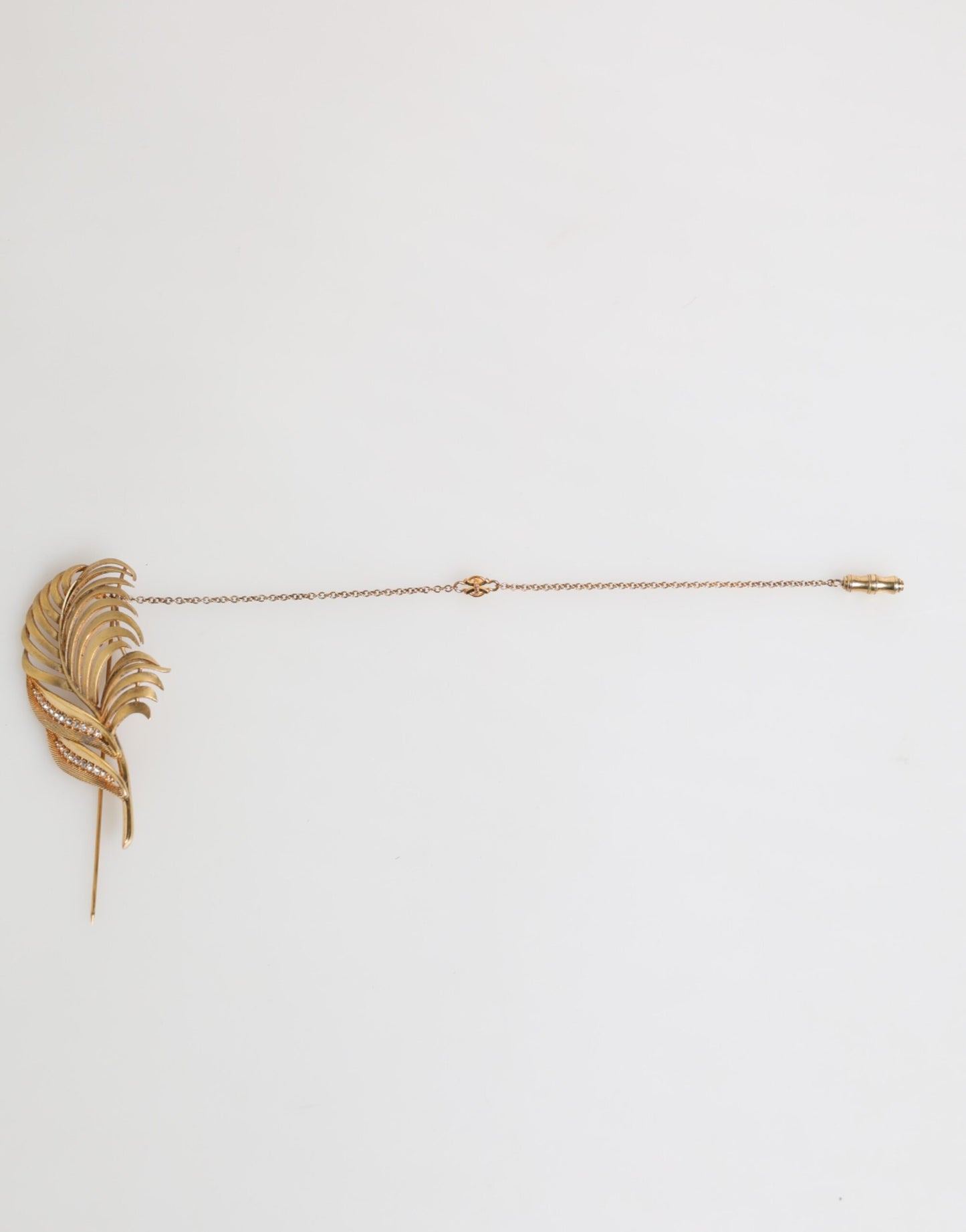 Broche Dolce &amp; Gabbana en forme de feuille, plaquée or, avec chaîne en cristal et argent sterling 925.