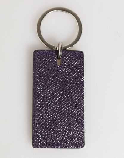 Porte-clés homme Dolce &amp; Gabbana en cuir violet avec logo métallique et anneau.