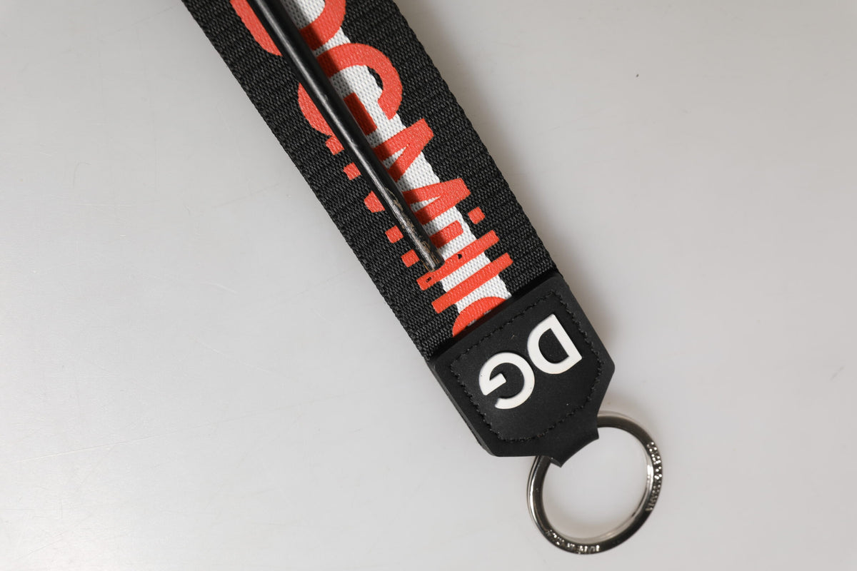 Porte-clés Dolce &amp; Gabbana en polyester noir et rouge avec logo et porte-clés en laiton.