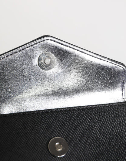 Portefeuille homme Michael Kors en cuir saffiano noir, format enveloppe.