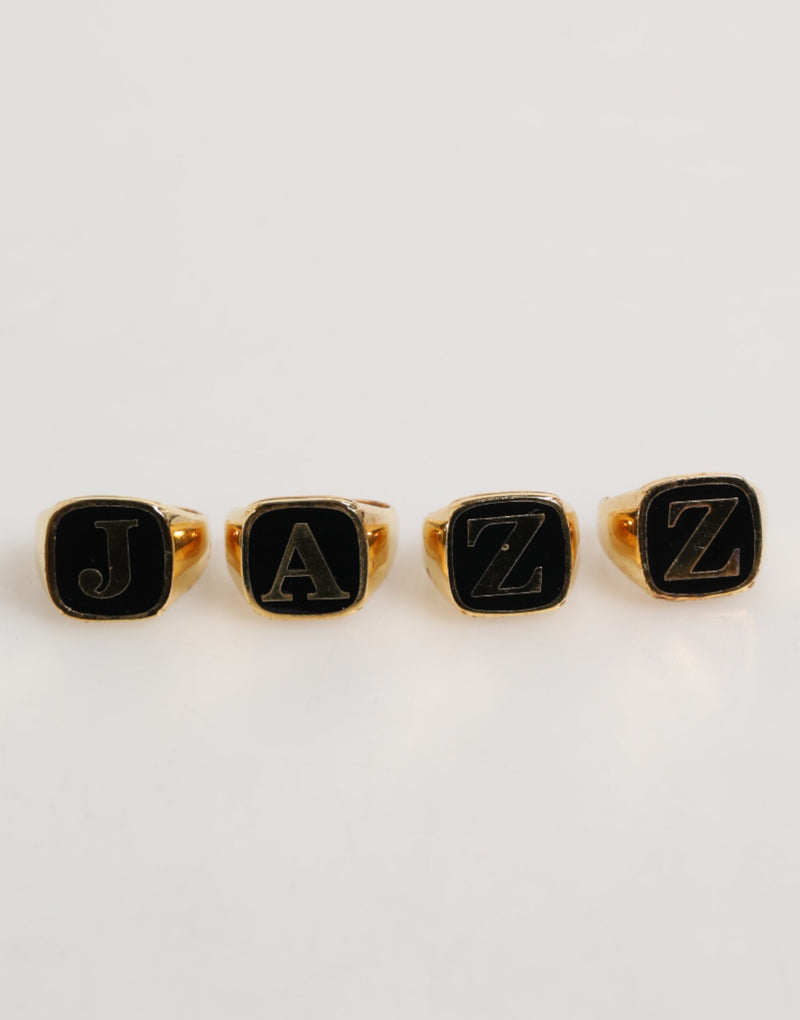 Dolce & Gabbana Gouden JAZZ Letterset van Messing, 4 stuks, Verstelbare Ring