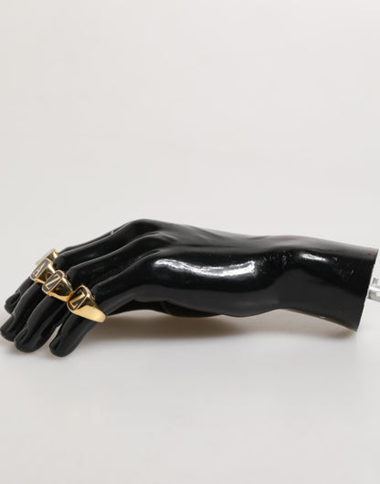 Ensemble de 4 bagues réglables Dolce &amp; Gabbana en laiton doré, avec inscription JAZZ.