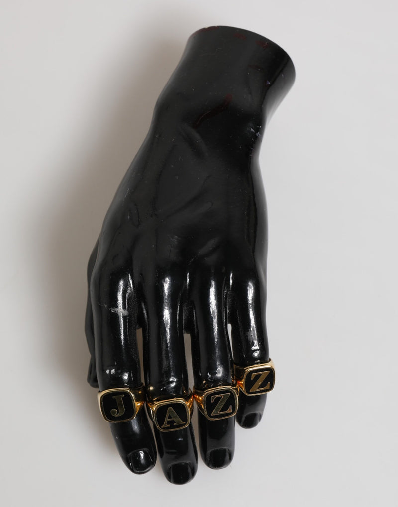 Dolce & Gabbana Gouden JAZZ Letterset van Messing, 4 stuks, Verstelbare Ring
