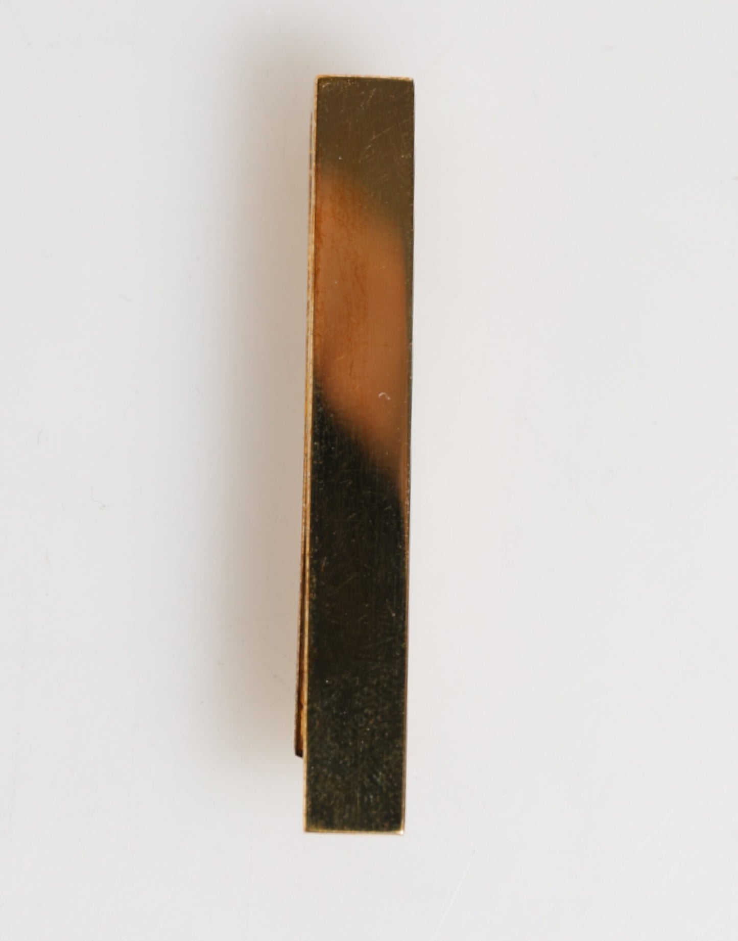 Barrette de cravate pour homme en laiton doré, logo Dolce &amp; Gabbana.