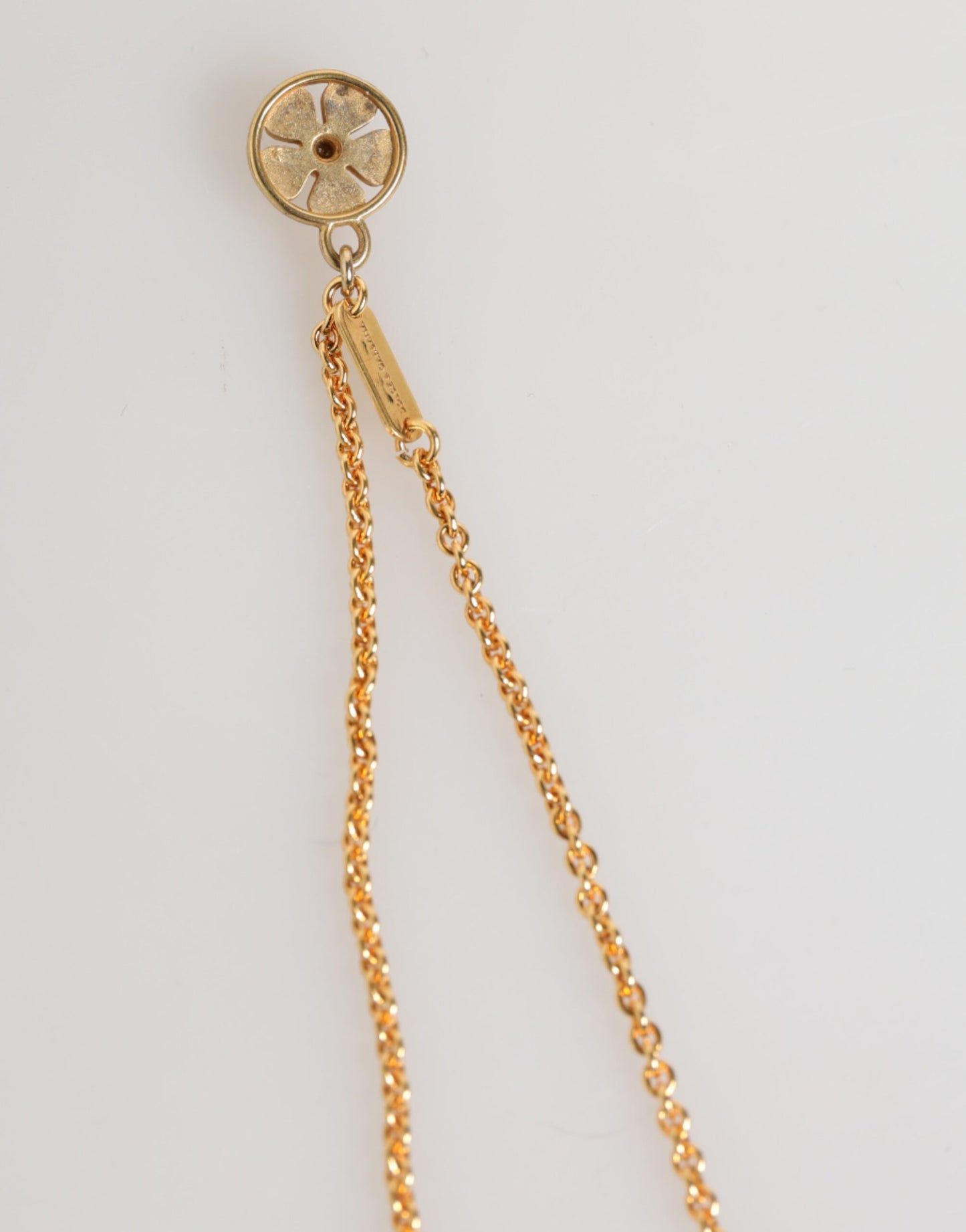 Pendentif collier homme Dolce &amp; Gabbana, médaille dorée sur chaîne en métal.
