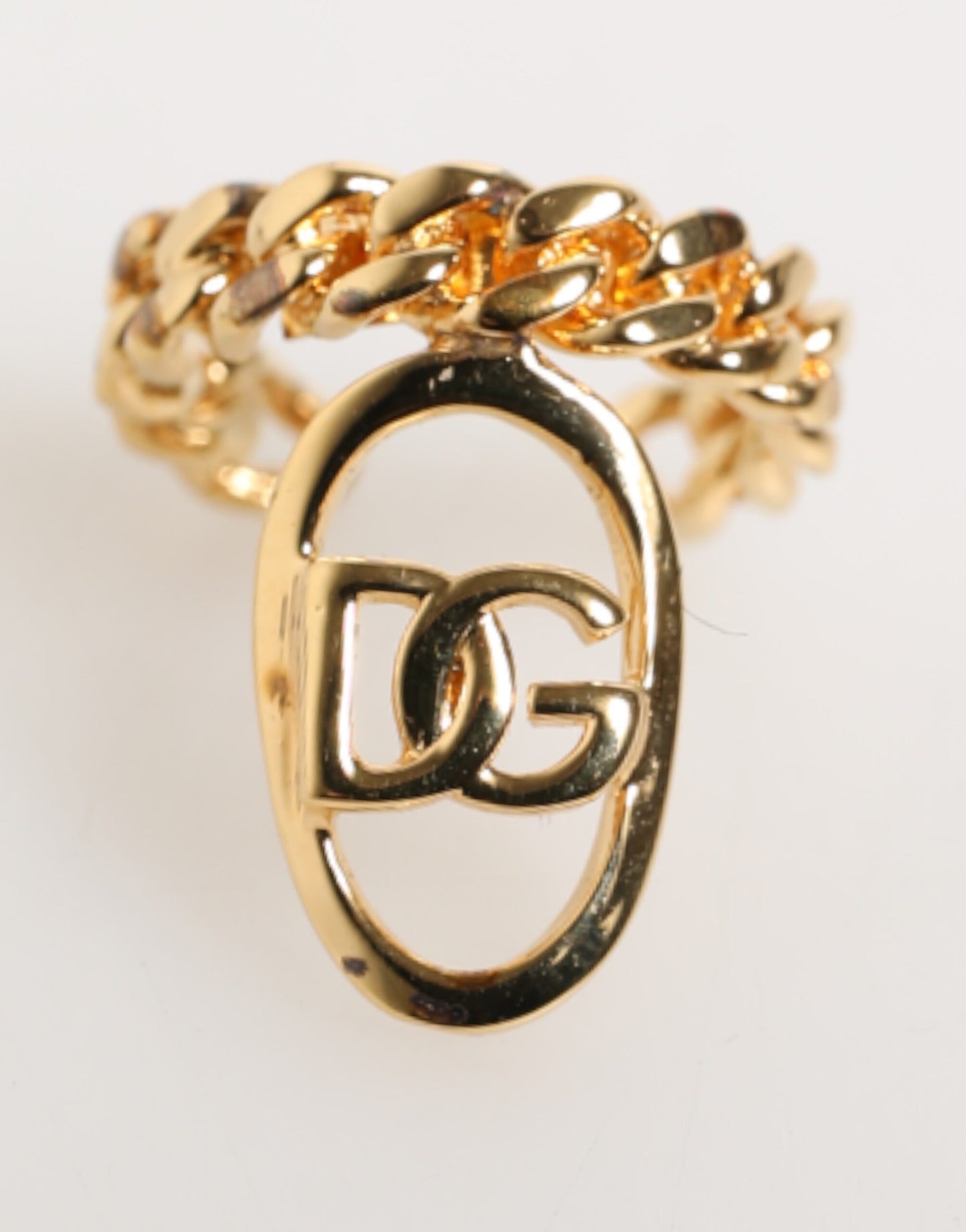 Bague réglable Dolce &amp; Gabbana en laiton doré, avec chaîne et logo DG ovale.