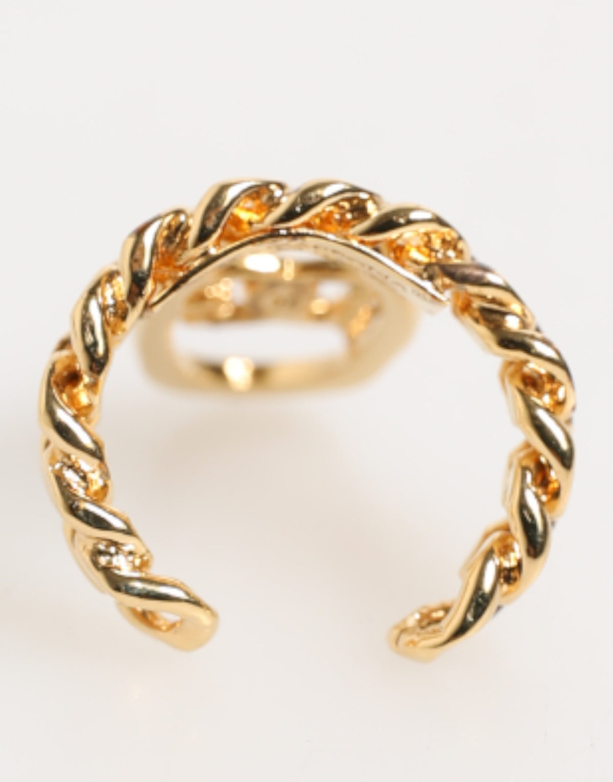 Bague réglable Dolce & Gabbana en laiton doré, avec chaîne et logo DG ovale.