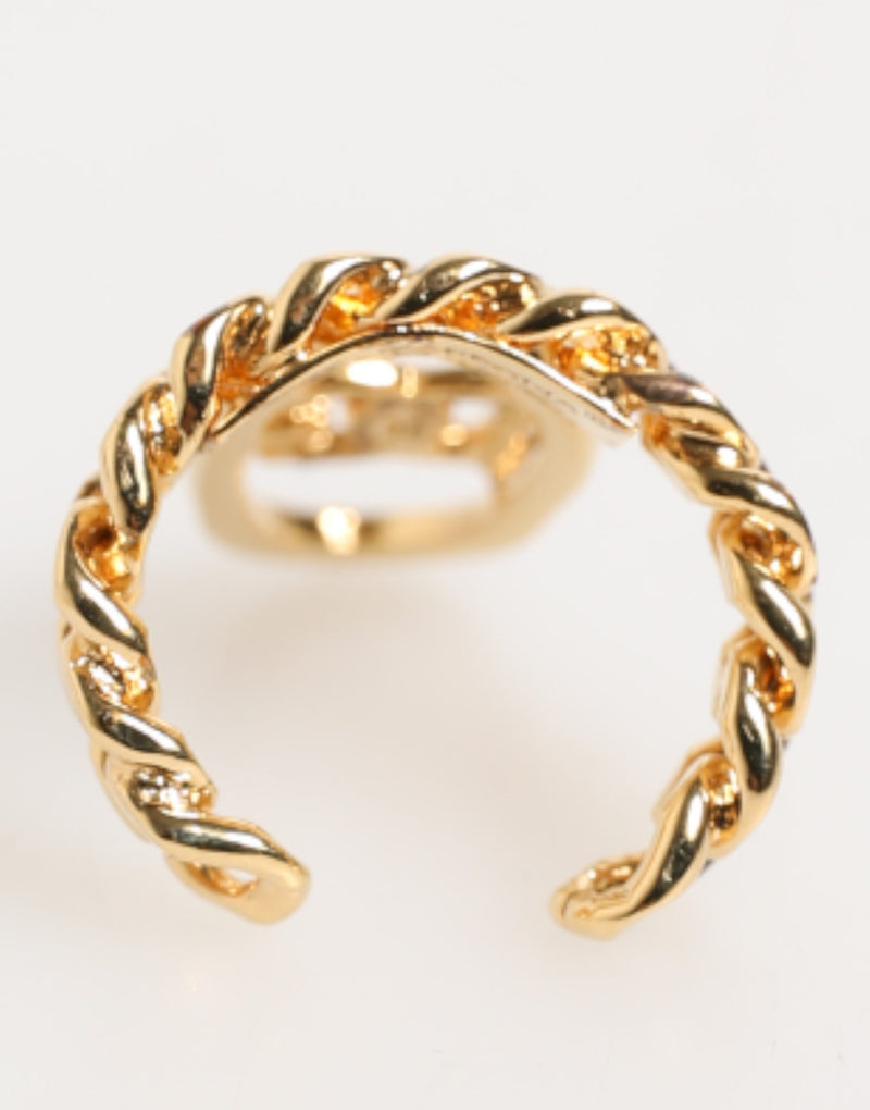 Bague réglable Dolce & Gabbana en laiton doré, avec chaîne et logo DG ovale.