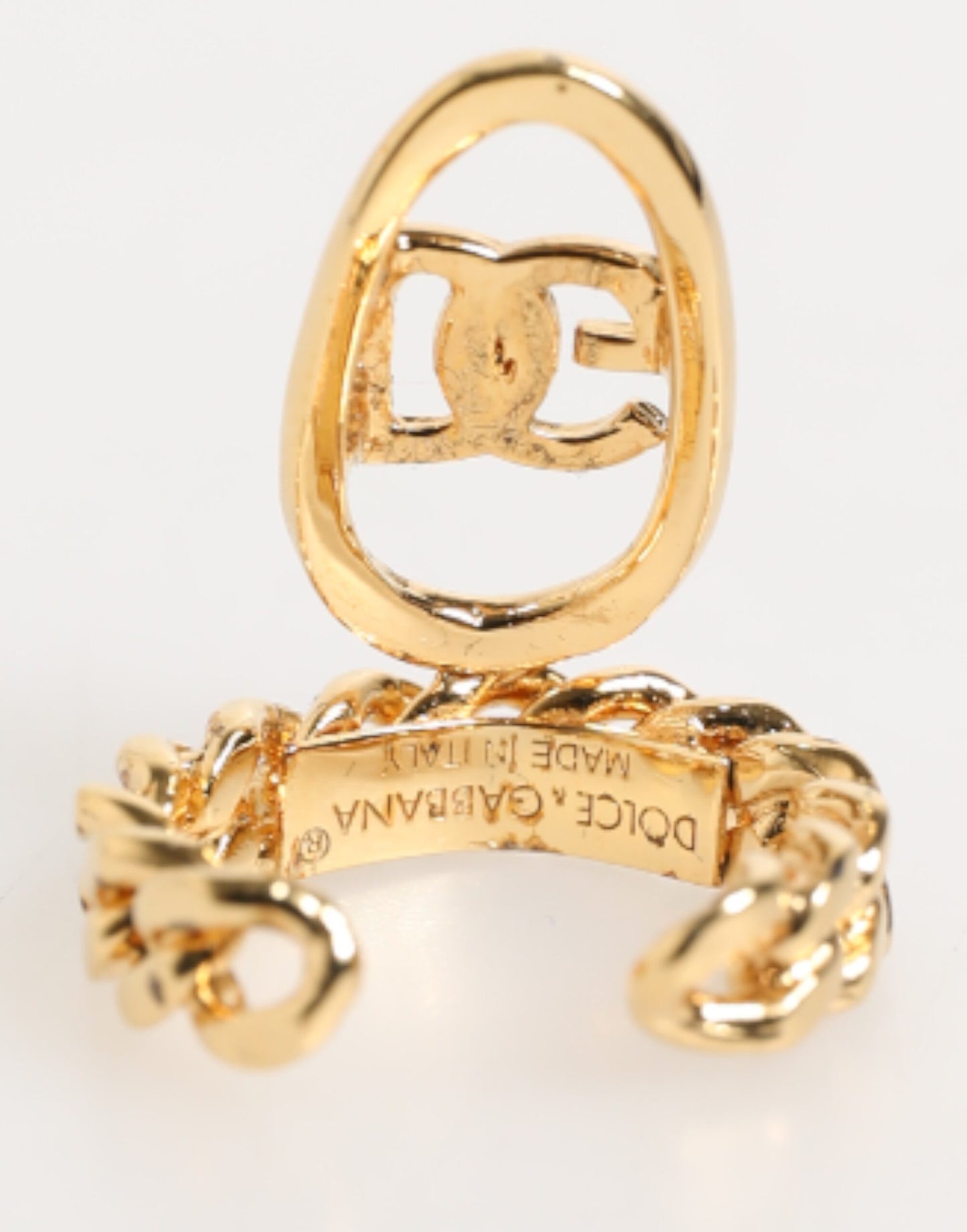Bague réglable Dolce &amp; Gabbana en laiton doré, avec chaîne et logo DG ovale.