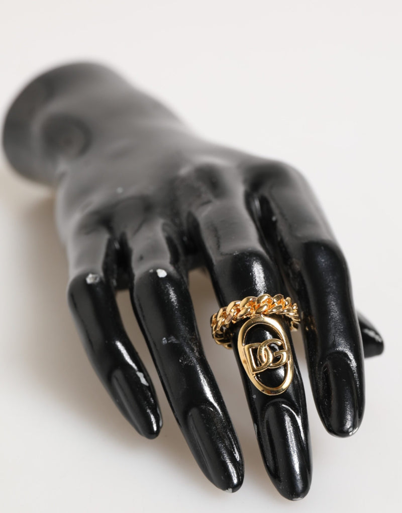Bague réglable Dolce & Gabbana en laiton doré, avec chaîne et logo DG ovale.