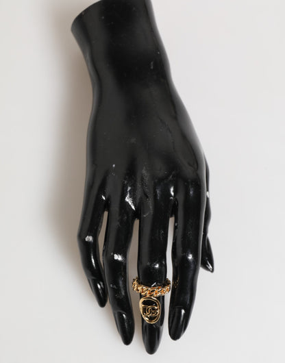Bague réglable Dolce &amp; Gabbana en laiton doré, avec chaîne et logo DG ovale.