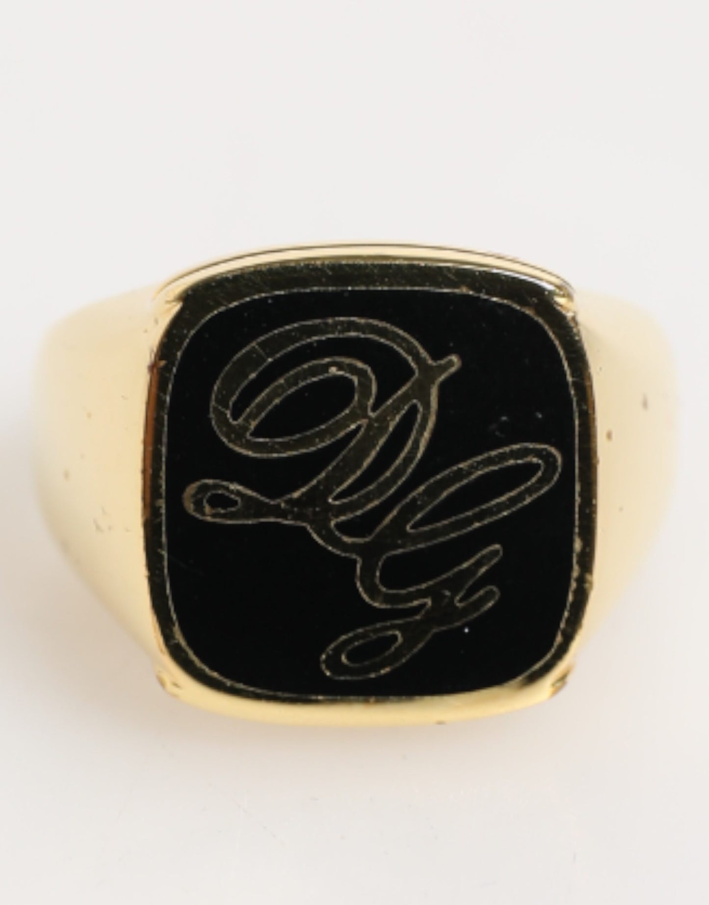 Bague signet DG en laiton doré et émail, logo ajustable de Dolce & Gabbana.