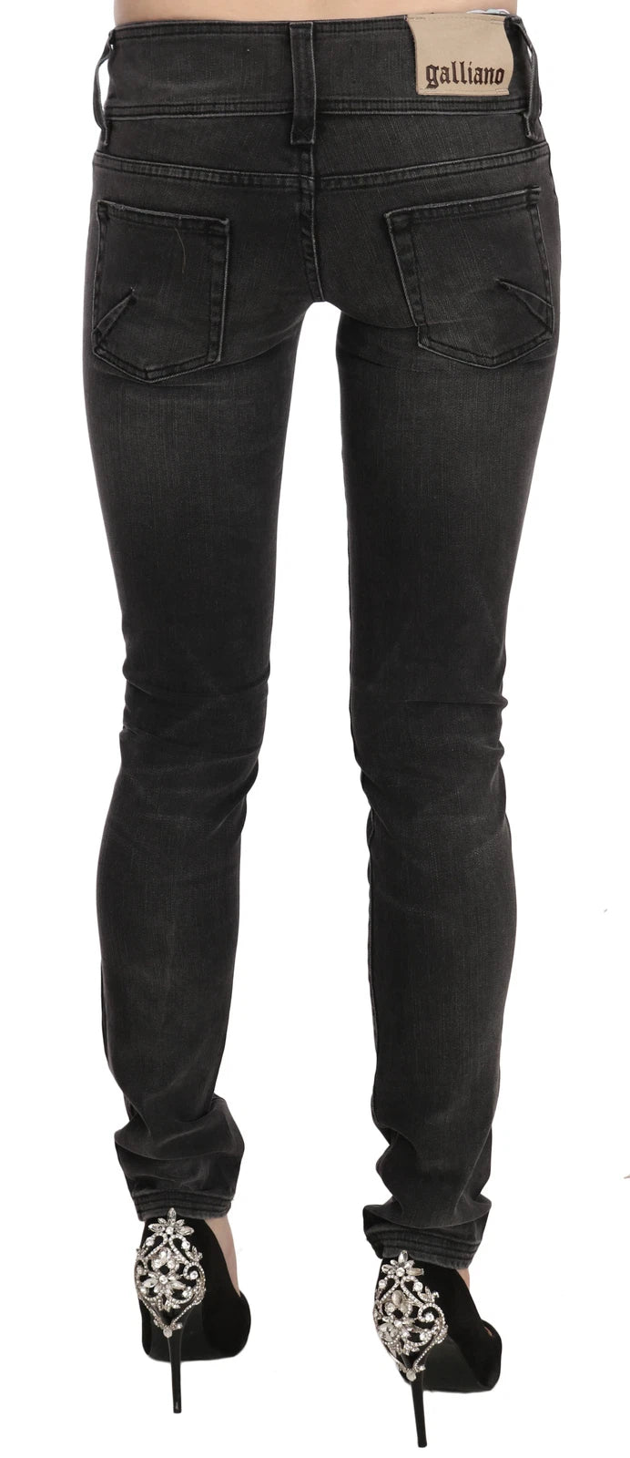 Jean skinny noir délavé, taille basse et coupe ajustée de John Galliano.