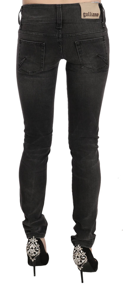 Jean skinny noir délavé, taille basse et coupe ajustée de John Galliano.