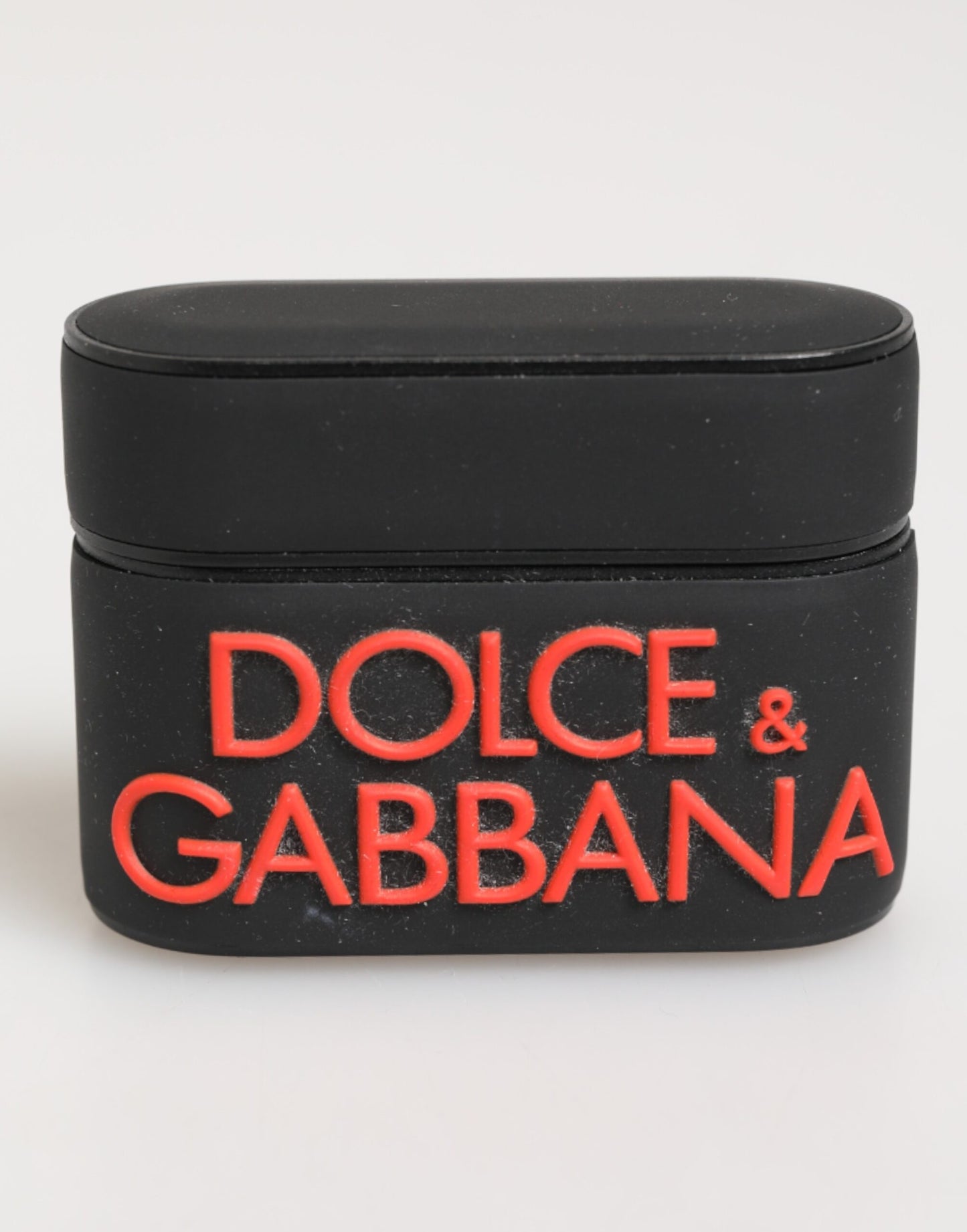 Étui Airpods en caoutchouc noir et orange avec logo en relief Dolce & Gabbana
