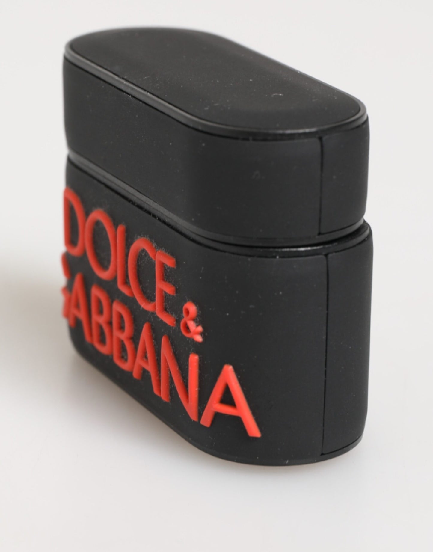 Étui Airpods en caoutchouc noir et orange avec logo en relief Dolce & Gabbana