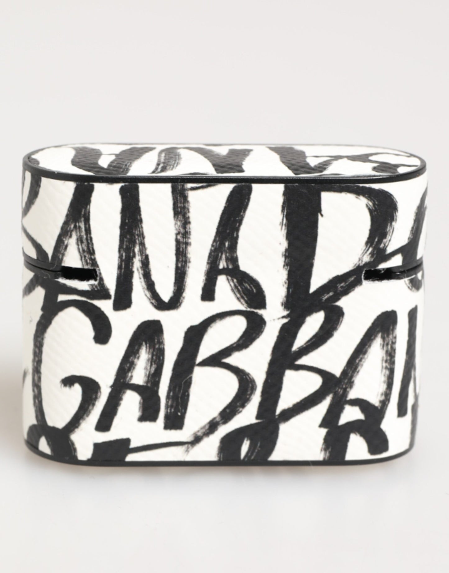 Étui pour Airpods Dolce & Gabbana en cuir noir et blanc avec imprimé monogramme et logo.