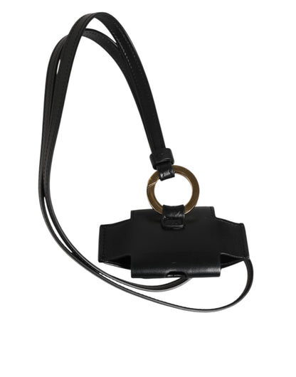 Étui Airpods Dolce & Gabbana en cuir noir avec plaque dorée en métal portant le logo DG.