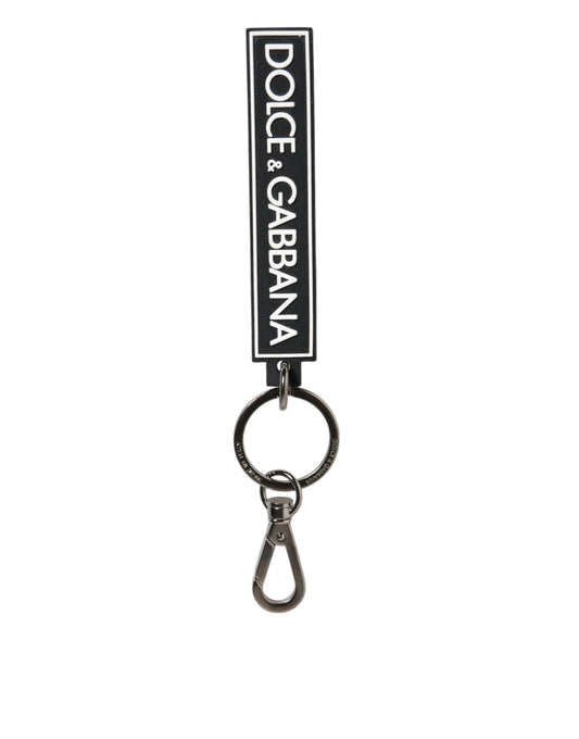 Porte-clés homme Dolce & Gabbana en caoutchouc noir et blanc avec logo DG argenté.