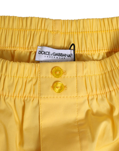Maillot de bain court Dolce & Gabbana en coton jaune avec taille élastique.