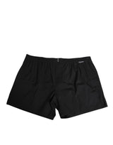 Maillot de bain Dolce &amp; Gabbana en coton noir avec taille élastique et boutons.