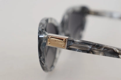 Lunettes de soleil Dolce & Gabbana DG4194, forme œil de chat, en acétate gris, avec plaque logo.