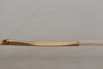 Lunettes de soleil Dolce & Gabbana DG2159B beige doré, forme papillon, avec strass.