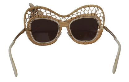 Lunettes de soleil Dolce & Gabbana DG2159B beige doré, forme papillon, avec strass.
