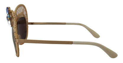 Lunettes de soleil Dolce & Gabbana DG2159B beige doré, forme papillon, avec strass.