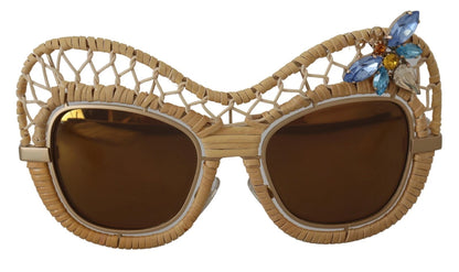 Lunettes de soleil Dolce & Gabbana DG2159B beige doré, forme papillon, avec strass.