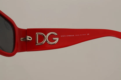 Lunettes de soleil Dolce & Gabbana DG4027, monture rouge cristal, verres noirs.