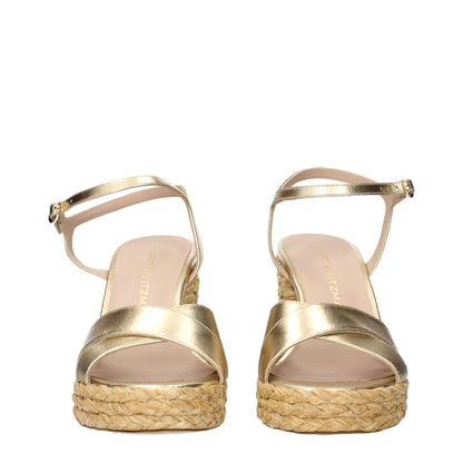 Plateformes en cuir doré de Stuart Weitzman