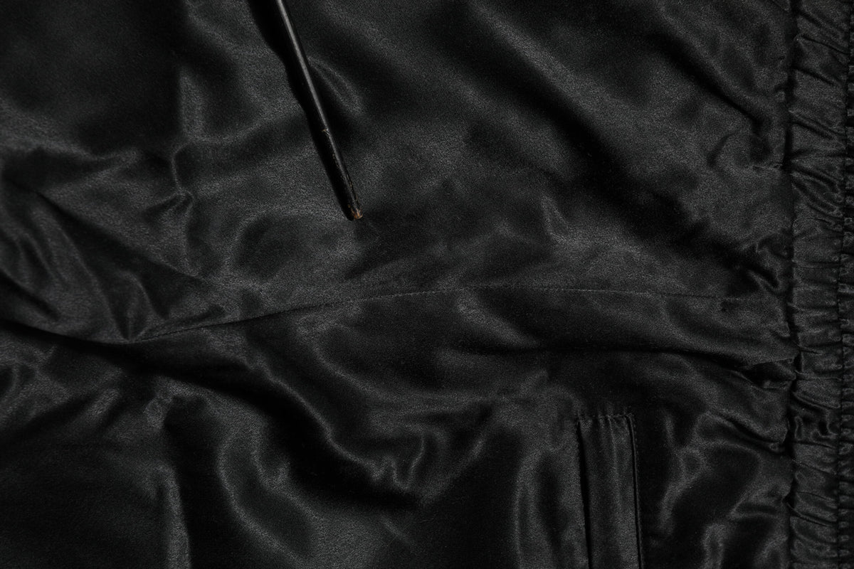 Pantalon de jogging Dolce &amp; Gabbana noir et or satiné avec bande latérale et couronne