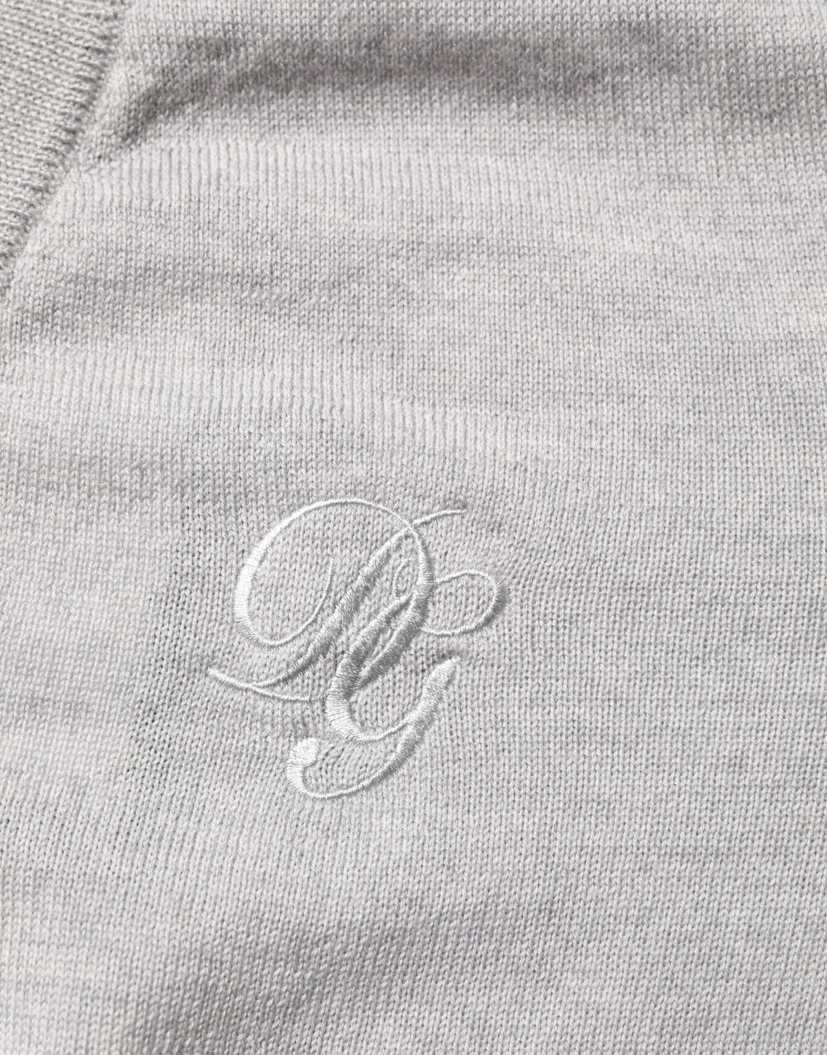 Pull en laine grise à col en V avec logo de Dolce &amp; Gabbana