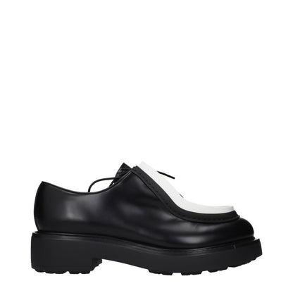Prada, souliers Oxford et mocassins en cuir noir