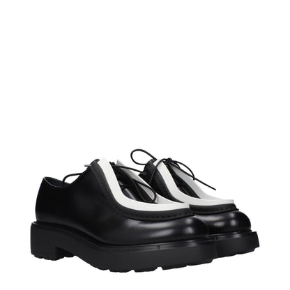 Prada, souliers Oxford et mocassins en cuir noir