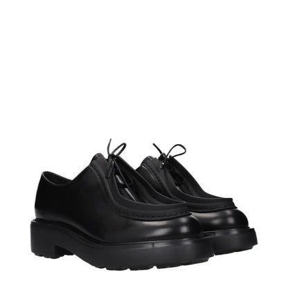 Prada, souliers Oxford et mocassins en cuir noir