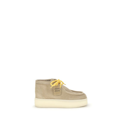 Bottes plates en cuir Miu Miu