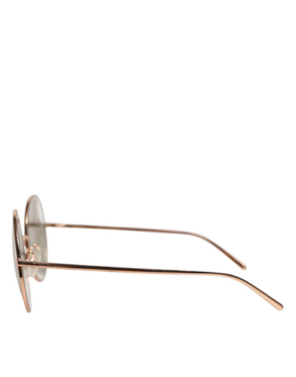 Lunettes de soleil Dolce &amp; Gabbana à verres ronds et monture plaquée or rose.