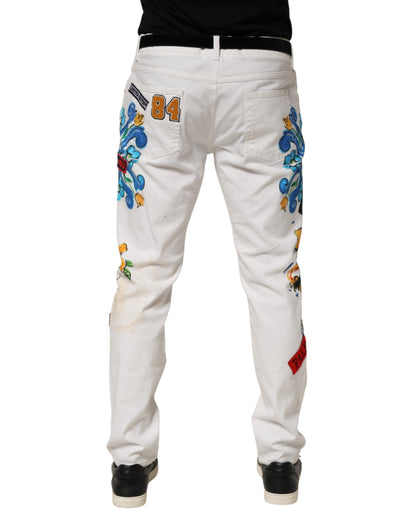Jeans skinny en jean doré à imprimé graffiti blanc Dolce &amp; Gabbana