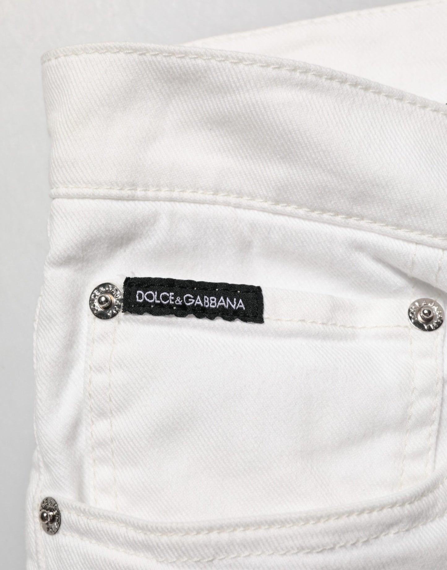 Jeans skinny en jean doré à imprimé graffiti blanc Dolce &amp; Gabbana