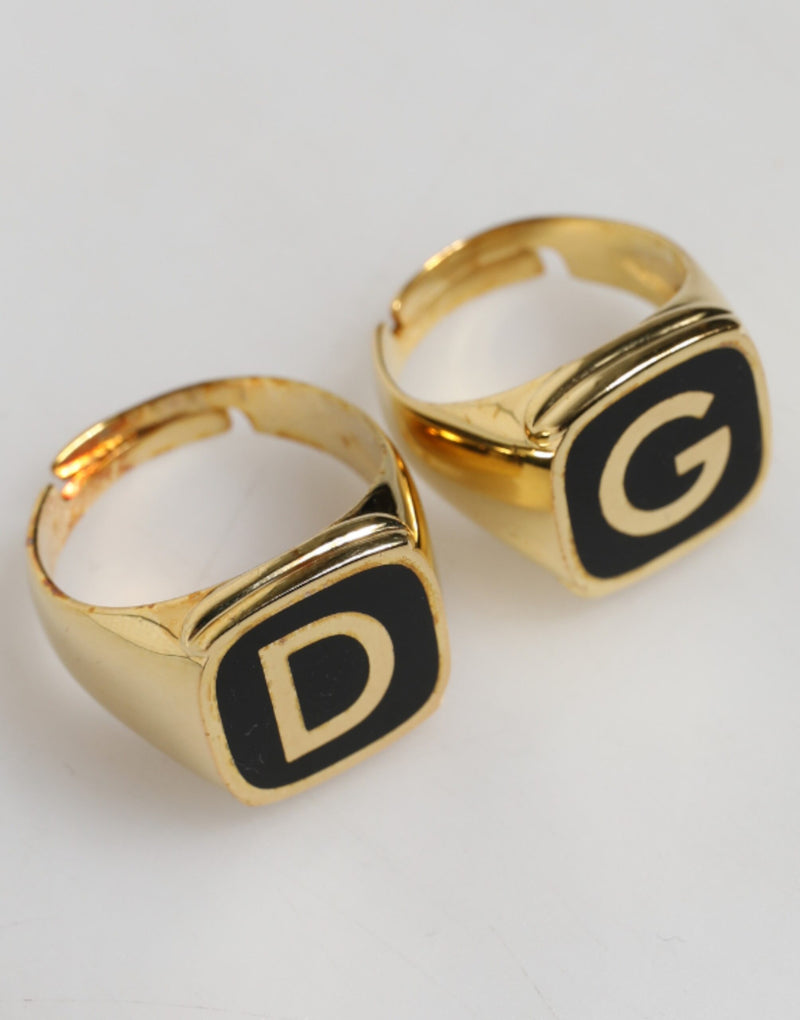 Dolce &amp; Gabbana Goudkleurige Echt Messing Zwarte Emaille "DG" Verstelbare Ringen