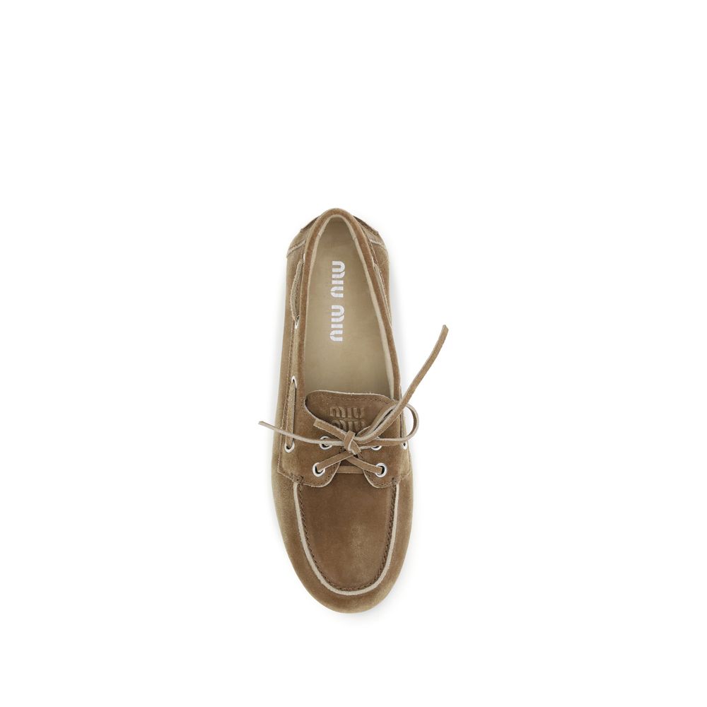 Mocassins à enfiler Bos Taurus en cuir de veau beige Miu Miu