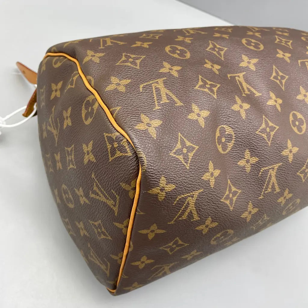 Sac à main d'occasion en cuir Louis Vuitton Speedy - bon état - Chakmar Luxe